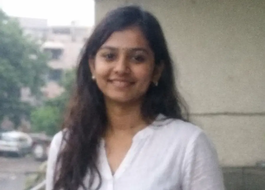 cropped Smiling woman on an urban balcony