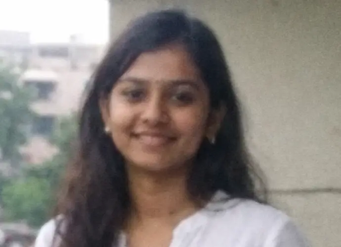 cropped cropped Smiling woman on an urban balcony